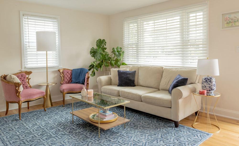 Cordless white wood blinds on a living room picture window