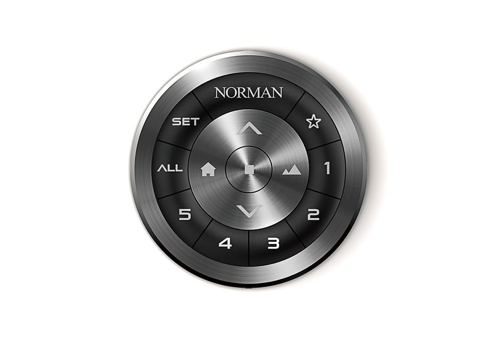 The Norman SmartDial remote, a round metal dial with five channel presets and a favorite-position button
