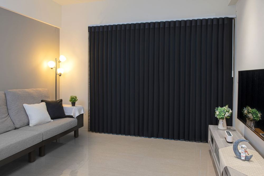 The same black SmartDrape® panels drawn fully closed