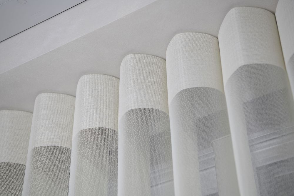 Close-up of cream SmartDrape® vanes at the headrail